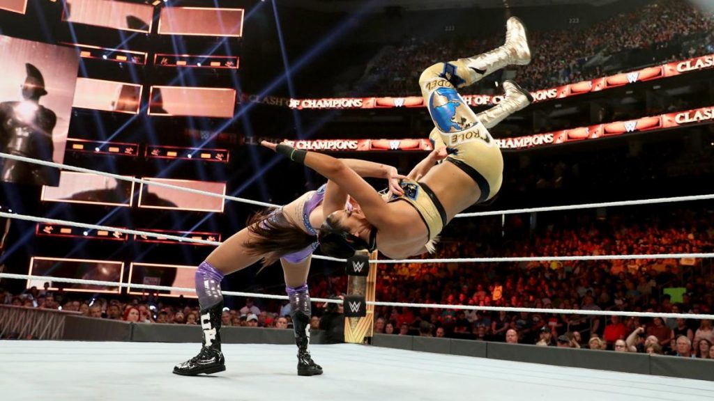Charlotte Flair suplexes Bayley