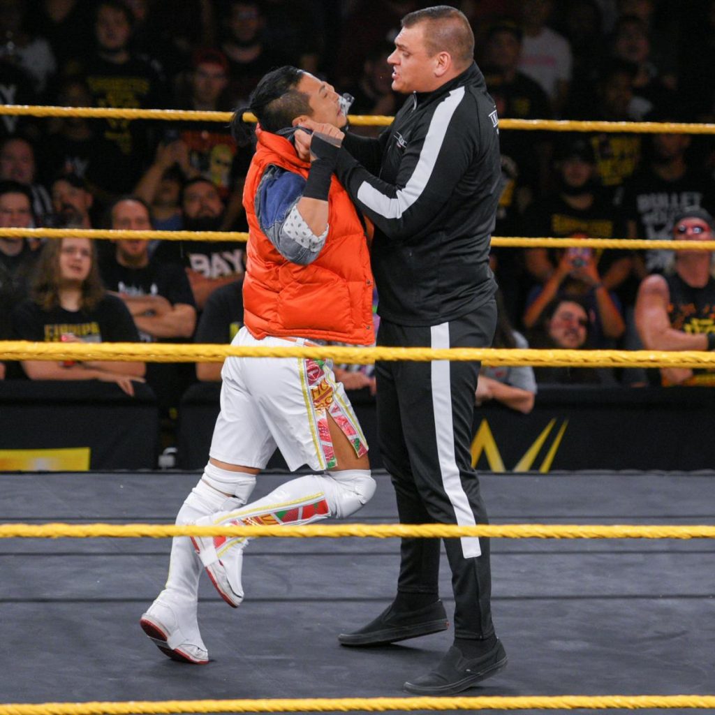 WALTER grabs Kushida by the head