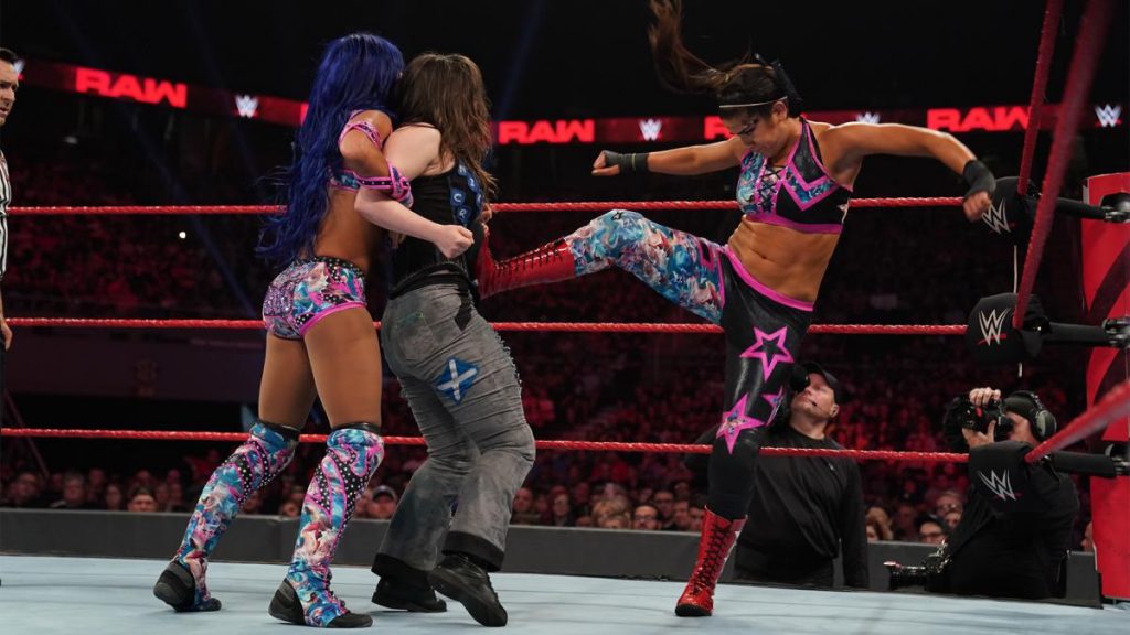 Bayley and Sasha Baks double team Nikki Cross