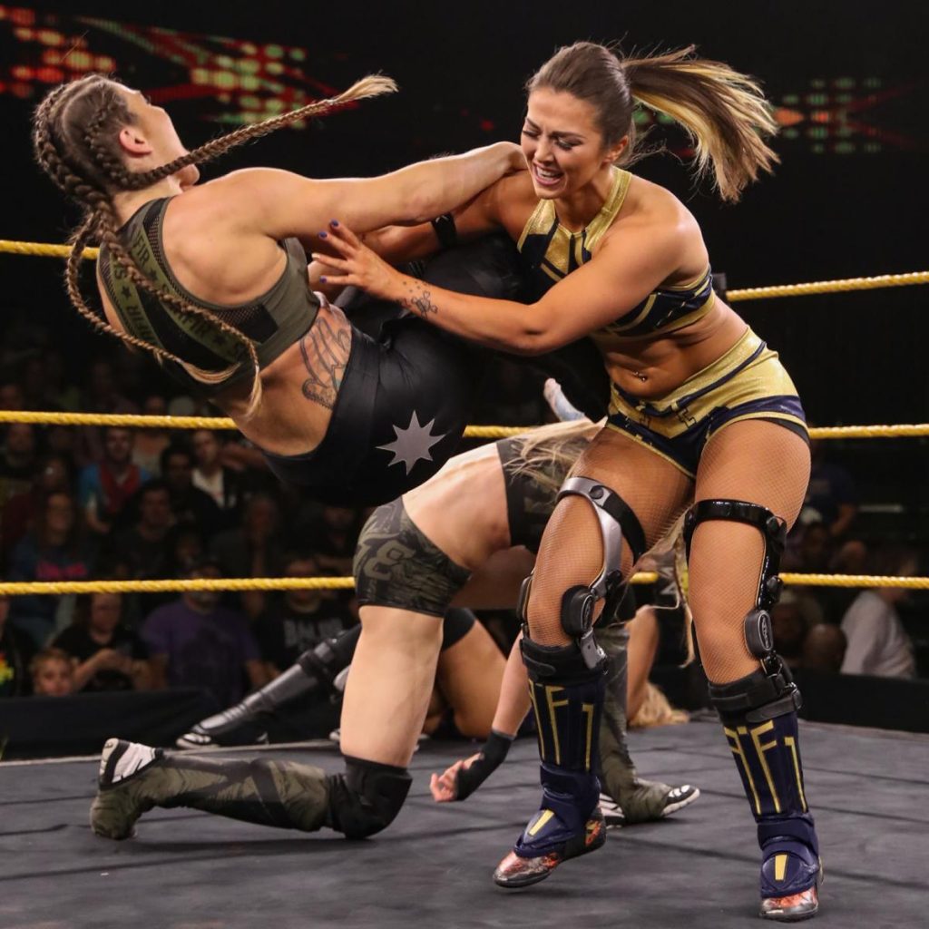 Tegan Nox takes down Marina Shaifir with Jessamyn Duke in the background