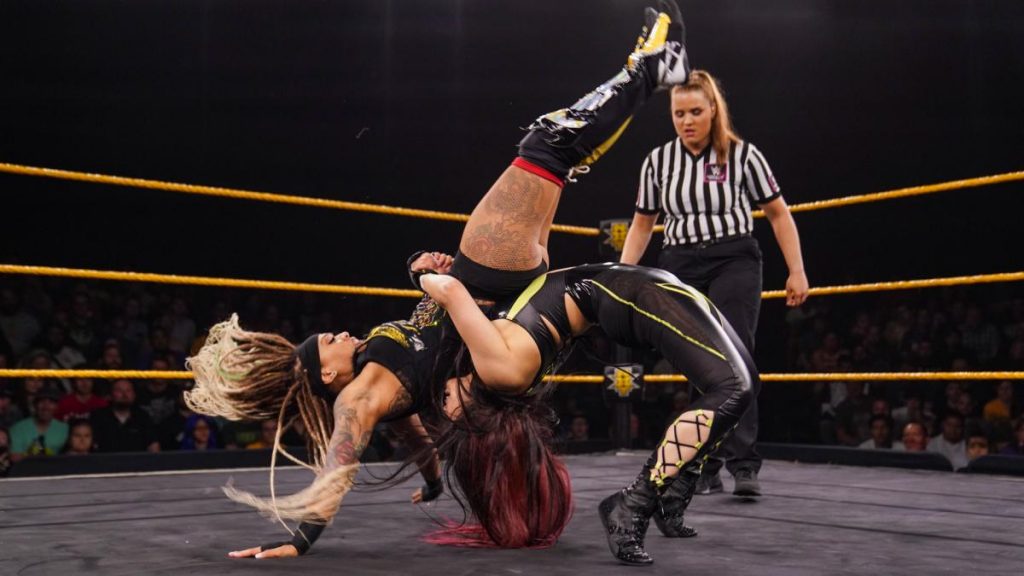 Io Shirai suplexes Kayden Carter