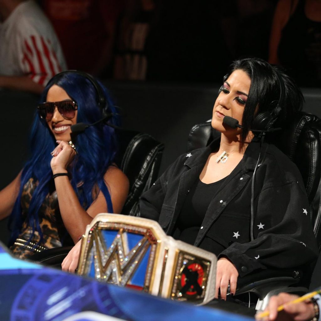 Bayley and Sasha Banks watch Nikki Cross