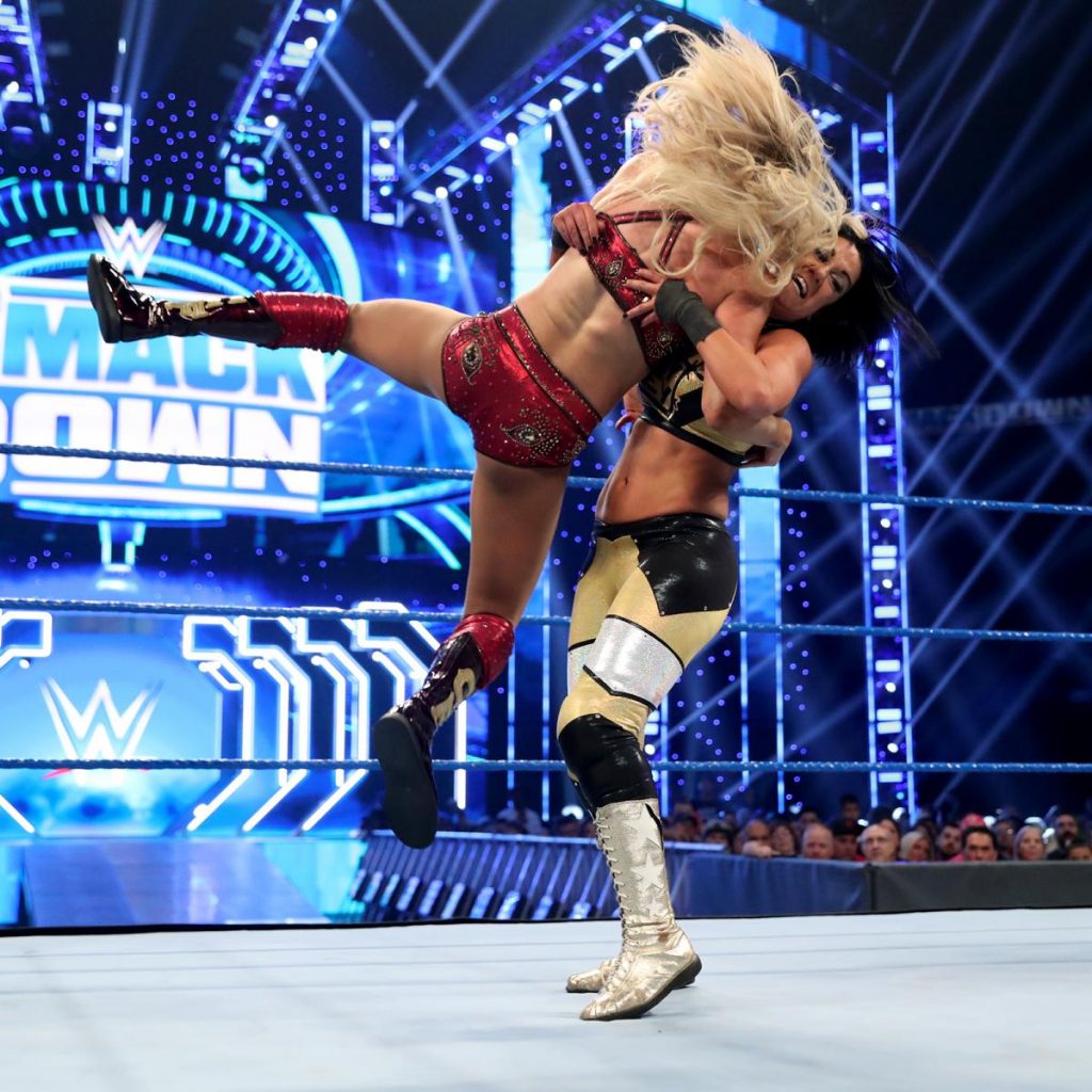 Charlotte Flair receives a Bayley to Belly