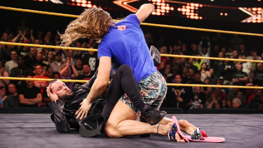 Matt Riddle beats on Finn Balor