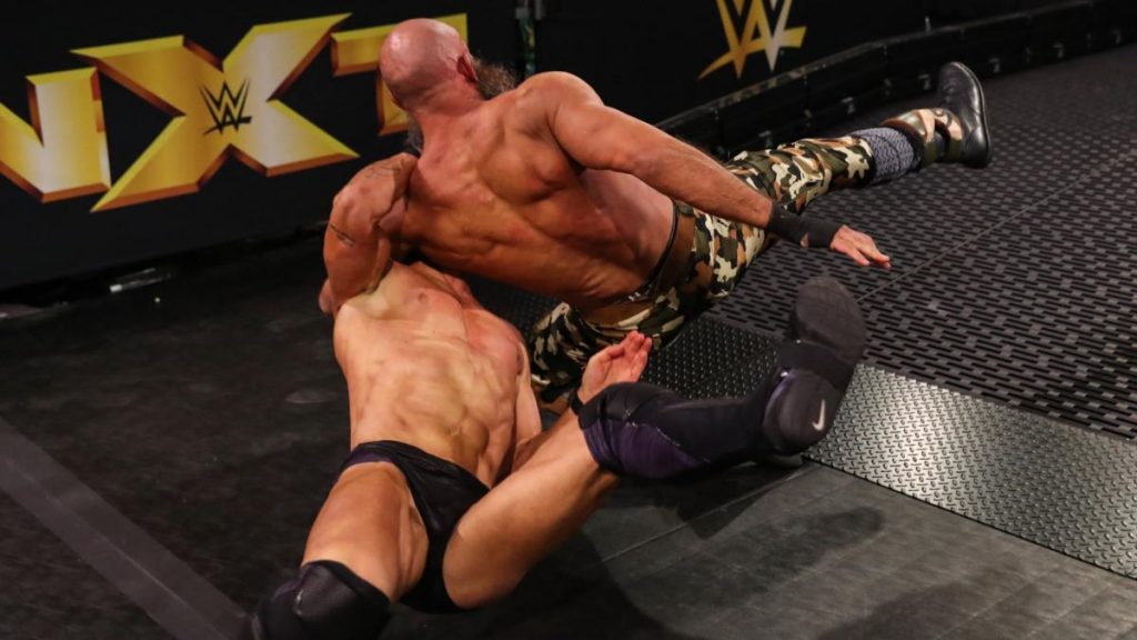 Tommaso Ciampa and Finn Blor after Balor took and Air Raid Crash on the ramp