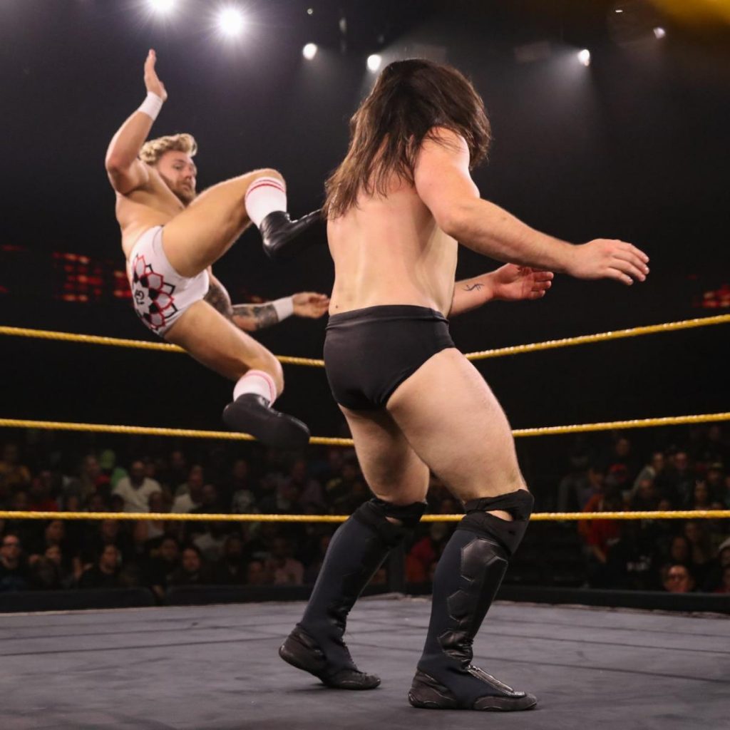Tyler Bate dropkicks Cameron Grimes