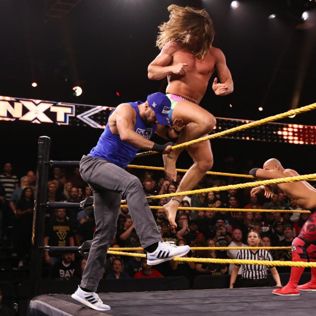 Matt Riddle knees Cesaro in the head, Ricochet in the background