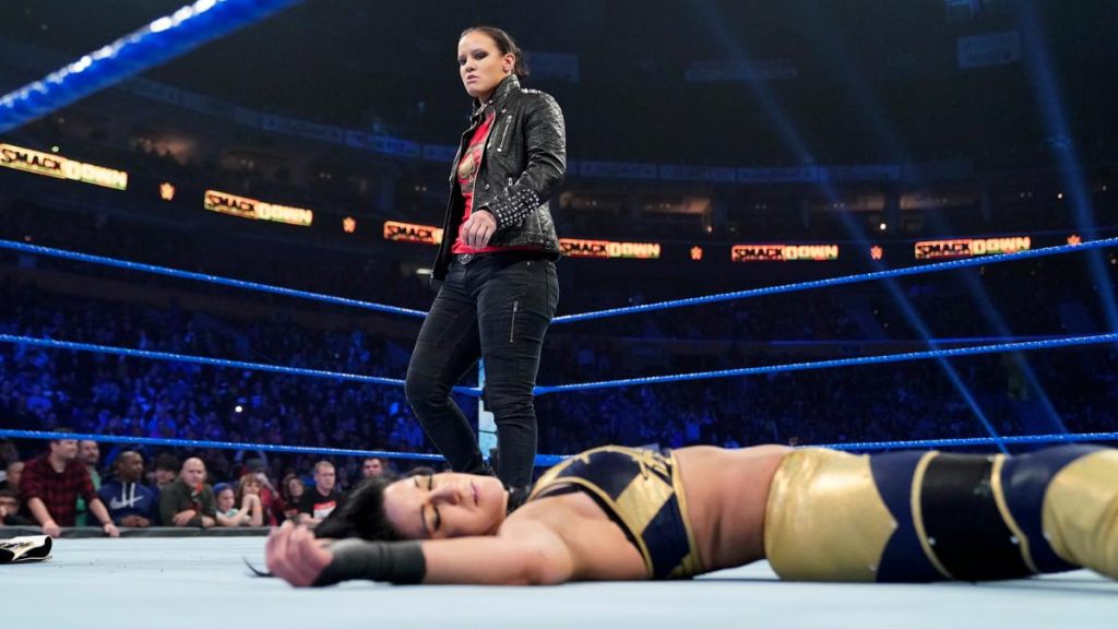 Shayna Baszler stands over Bayley after knocking her out