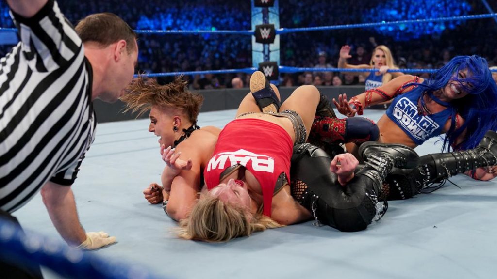 Rhea Ripley pins Charlotte Flair while Flair has Becky Lynch in the Figure Eight