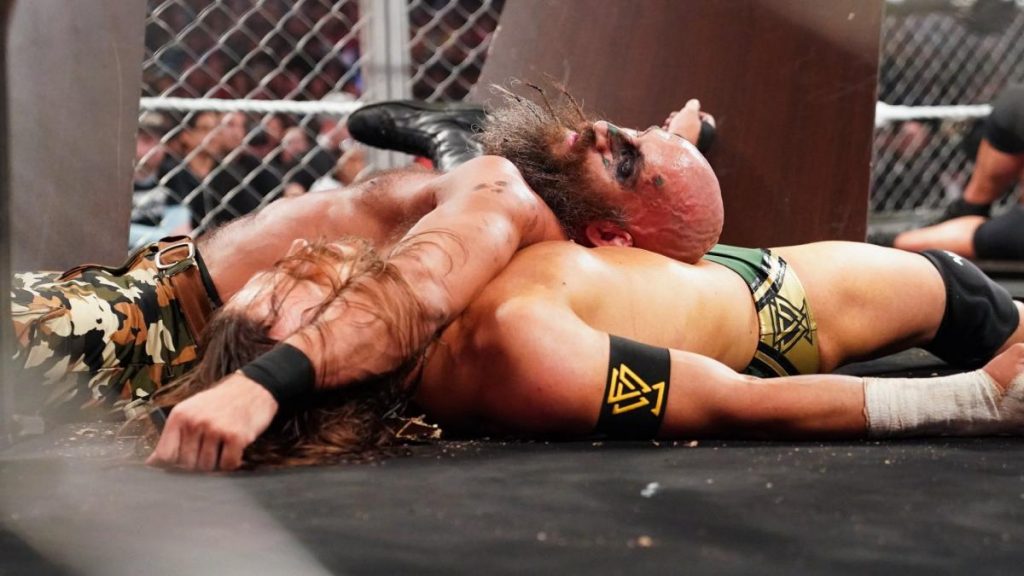 Undisputed ERA's Adam Cole lies under TOmmaso Ciampa having been pinned
