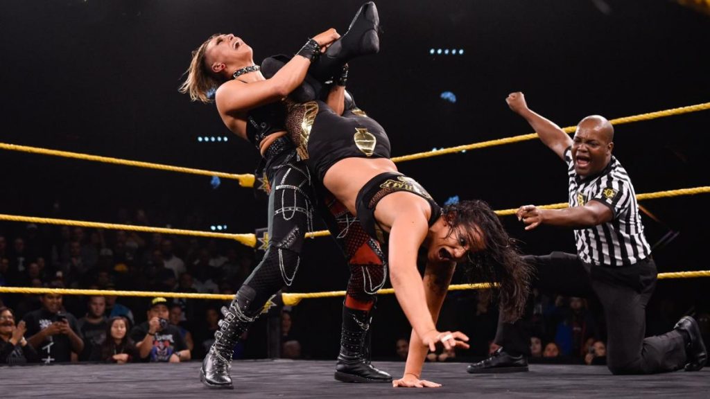 Rhea Ripley attempts to submit Shayna Baszler