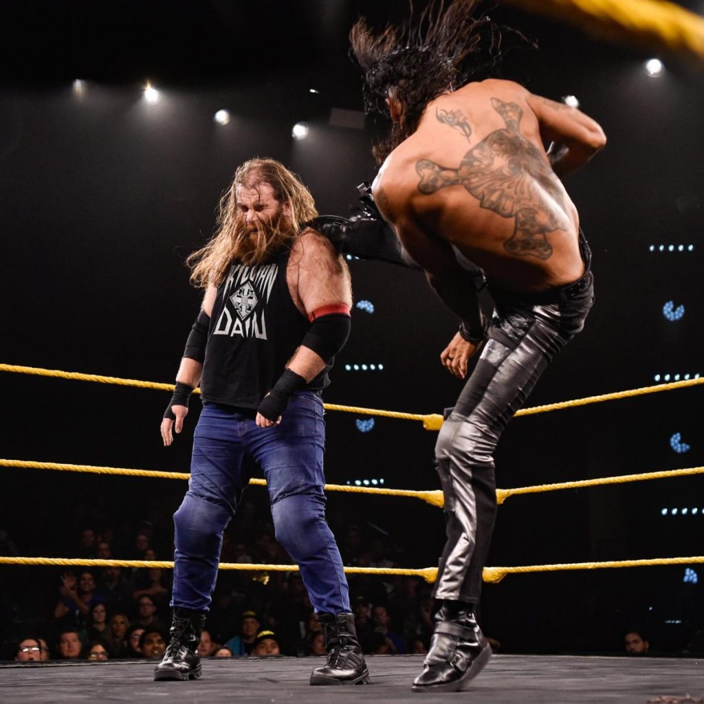 Damian Priest kicks Killian Dain in the head