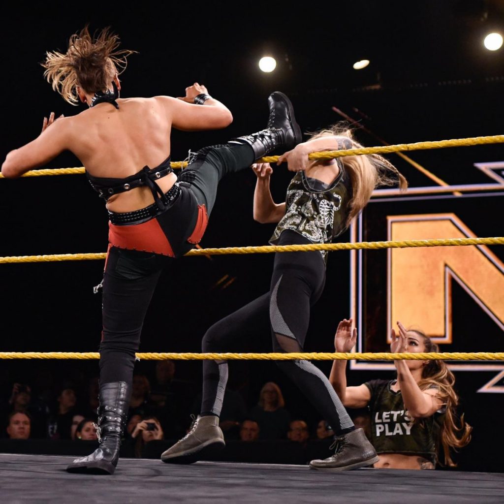 Rhea Ripley kicks Jessamyn Duke off the apron