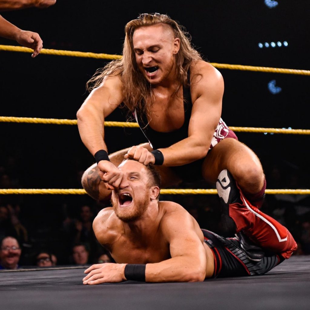 Pete Dunne tries to rip Travis Banks' nose off