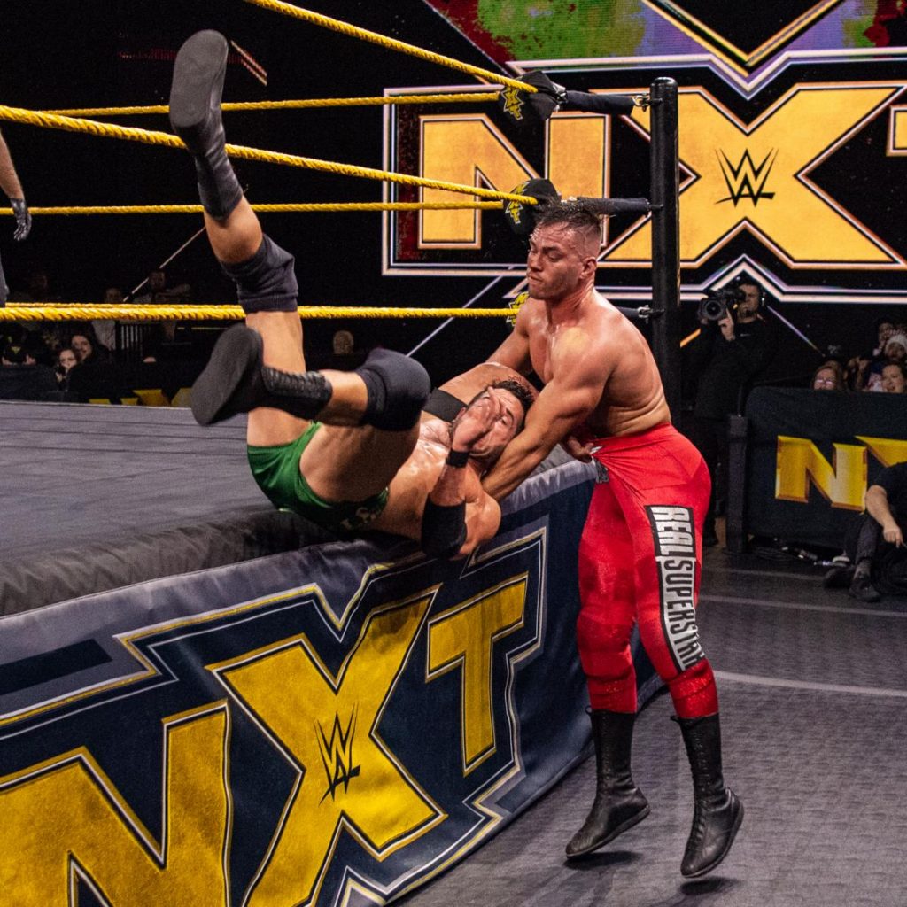 Austin Theory slams Roderick Strong on the apron