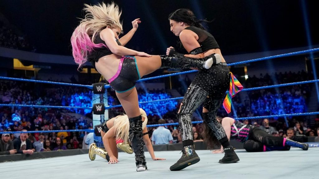Alexa Bliss kicks Sonya Deville with Mandy Rose and Nikki Cross in the background