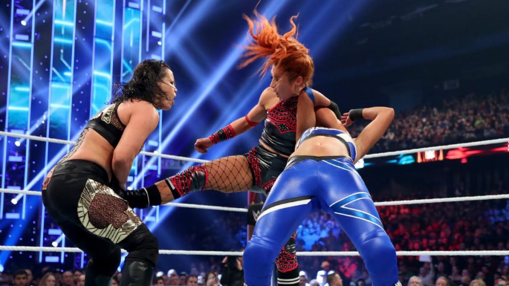 Becky Lynch tries to take out Bayley and Shayna Baszler
