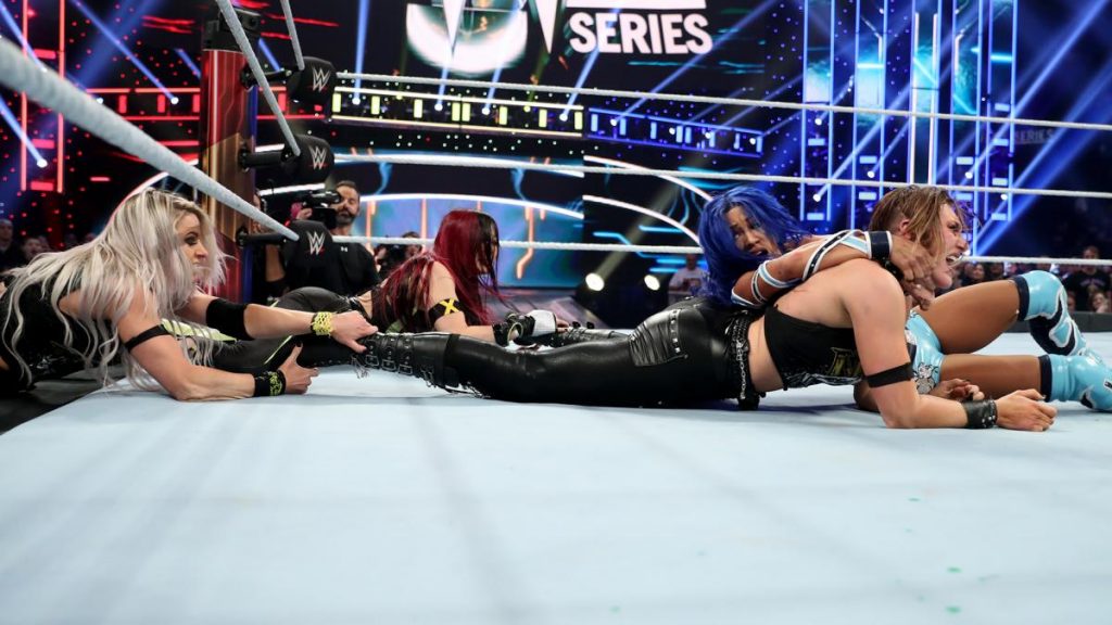 Io Shirai and Candice LeRae pull Rhea Ripley away from Sasha Banks