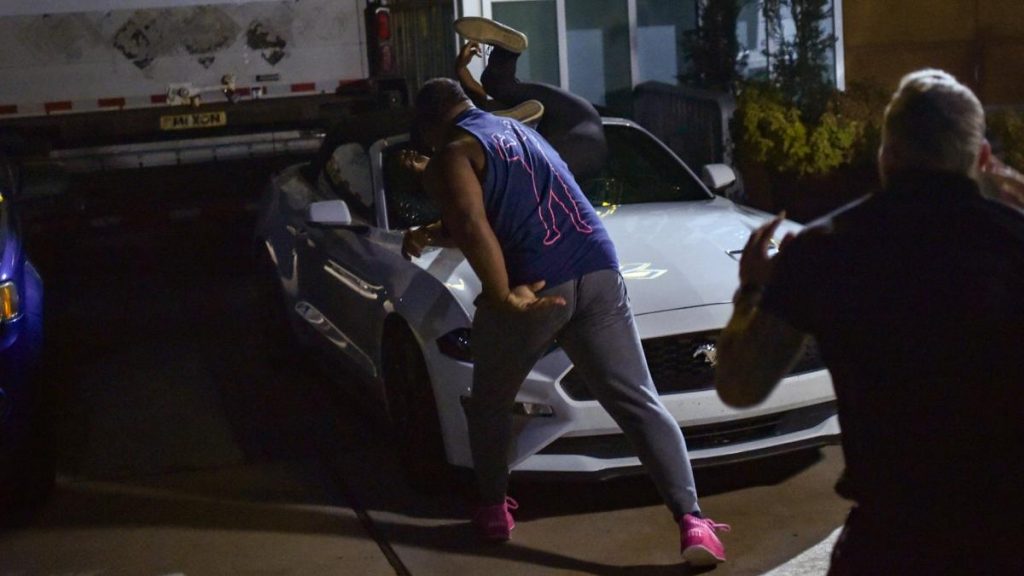 Keith Lee throws a security guard at a car