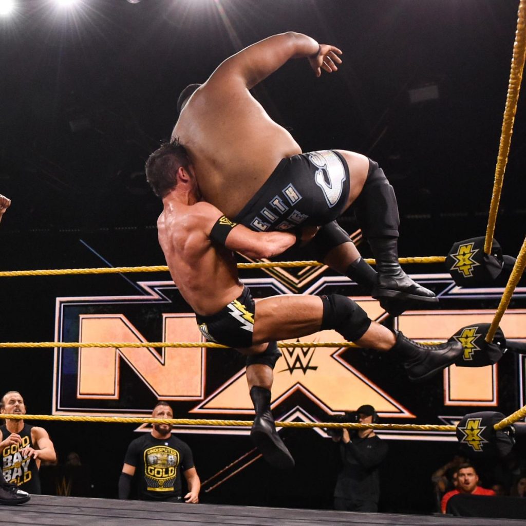 Roderick Strong delivers and avalanche olympic slam to Keith Lee