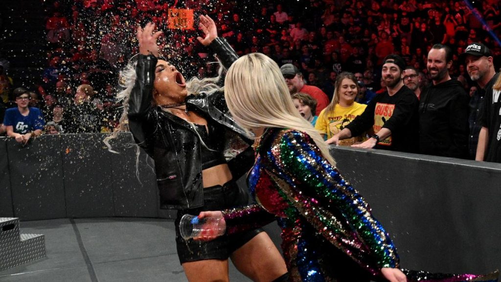 Lana throws a drink at Liv Morgan