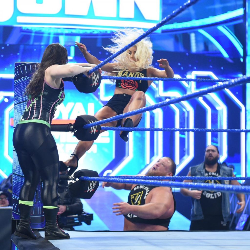 Nikki Cross knocks Mandy Rose off the apron into Otis' arms