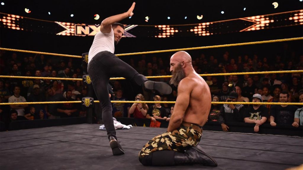 Johnny Gargano superkicks Tommaso Ciampa in the face