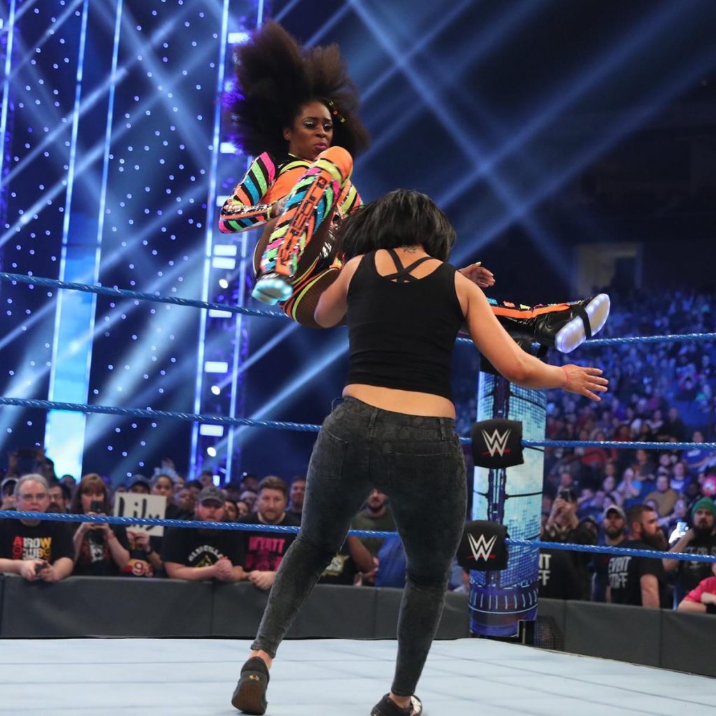 Naomi dropkicks Bayley