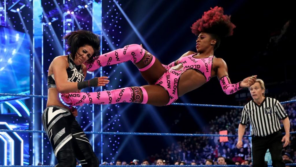 Naomi dropkicks Bayley
