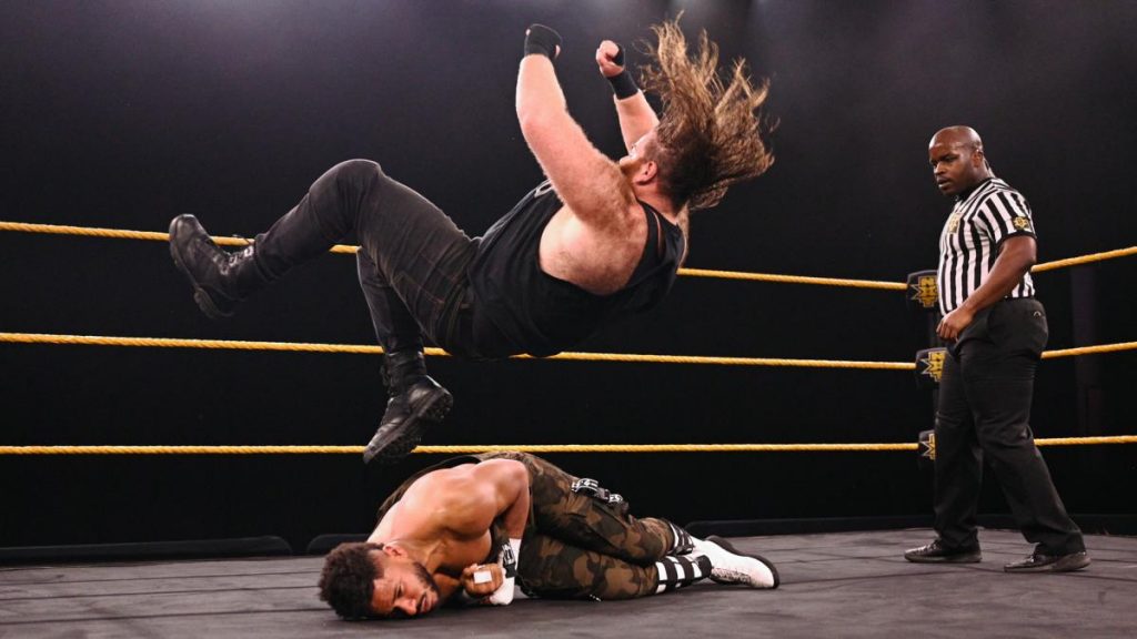 Killian Dain delivers a senton to Tehuti Miles