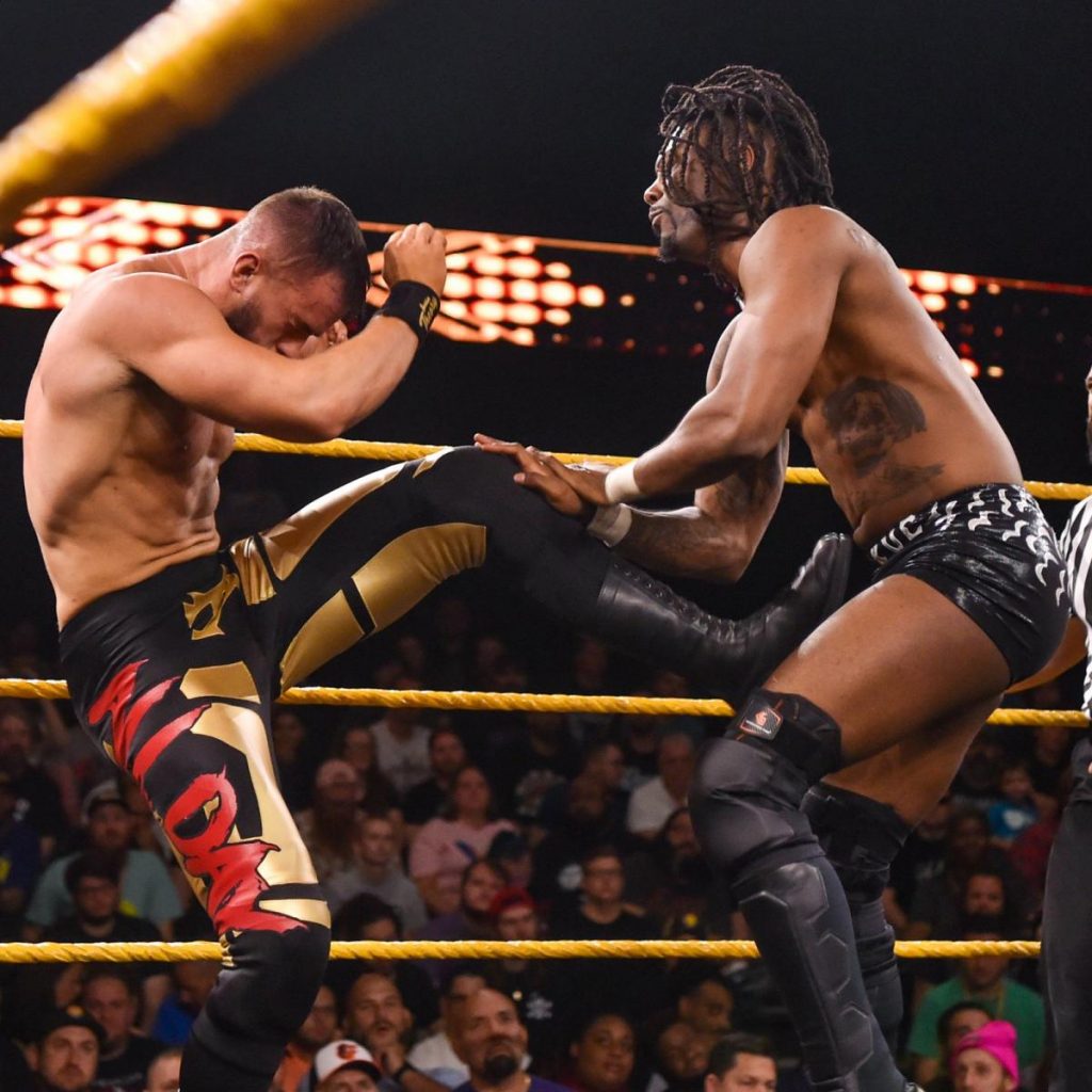 Isaiah 'Swerve' Scott catches Austin Theory's leg