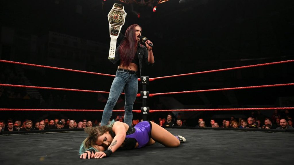 Kay Lee Ray stands over Dani Luna