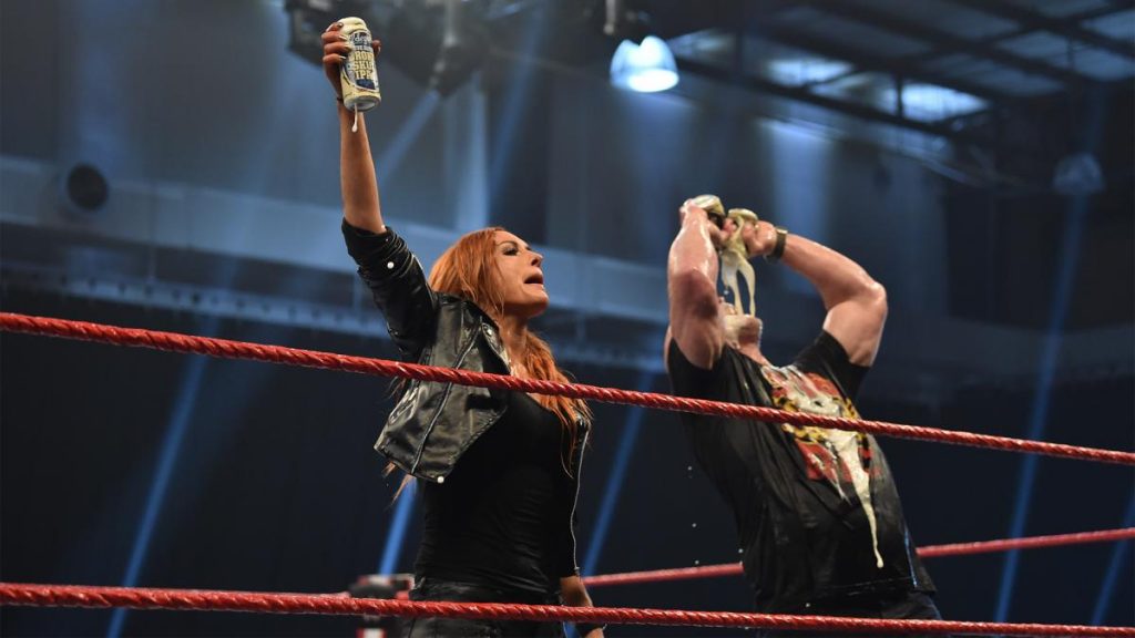 Becky Lynch poses with Steve Austin