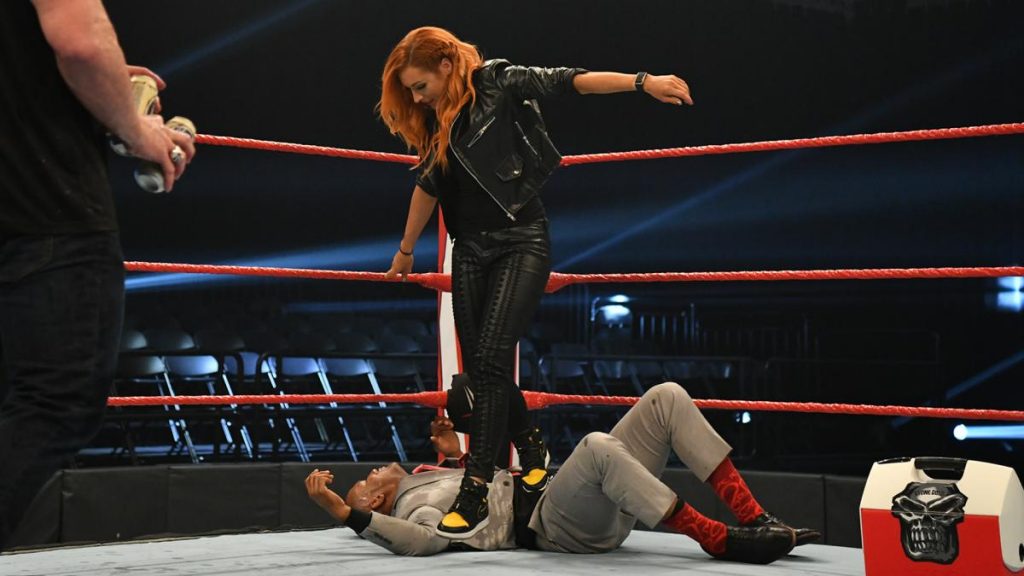 Becky Lynch steps on Byron Saxton getting into the ring