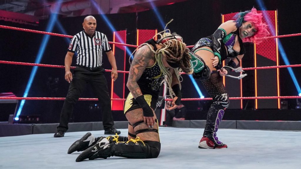 Asuka kicks Kayden Carter in the head