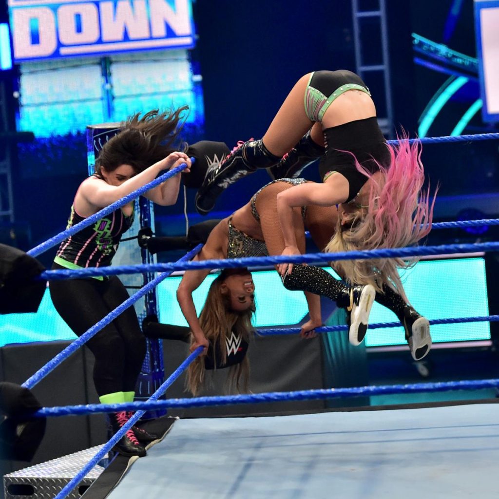 Alexa Bliss and Nikki Cross with Carmella in the corner