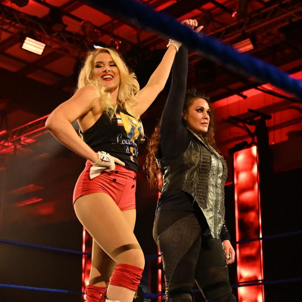 Lacey Evans raises Tamina's hand