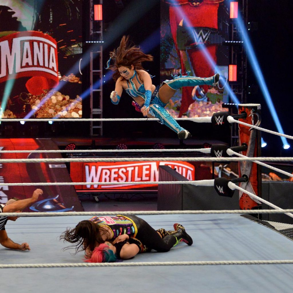 Kairi Sane drops an elbow to stop Nikki Cross pinning Asuka