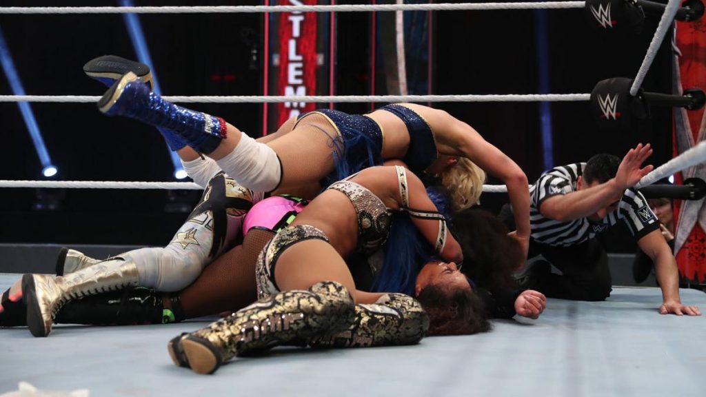 Lacey Evans, Sasha Banks, Naomi, and Bayley pile onto Tamina to pin her