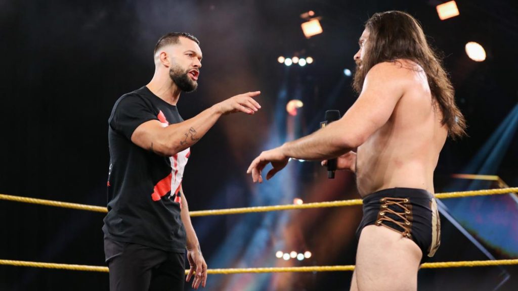 Finn Balor and Cameron Grimes argue