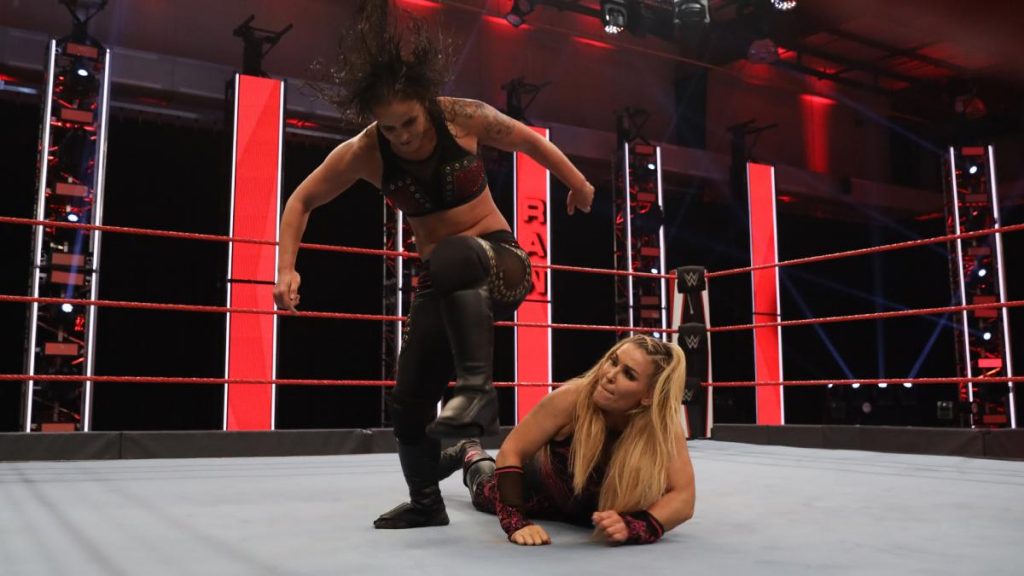Shayna Baszler tries to stamp on Natalya's arm