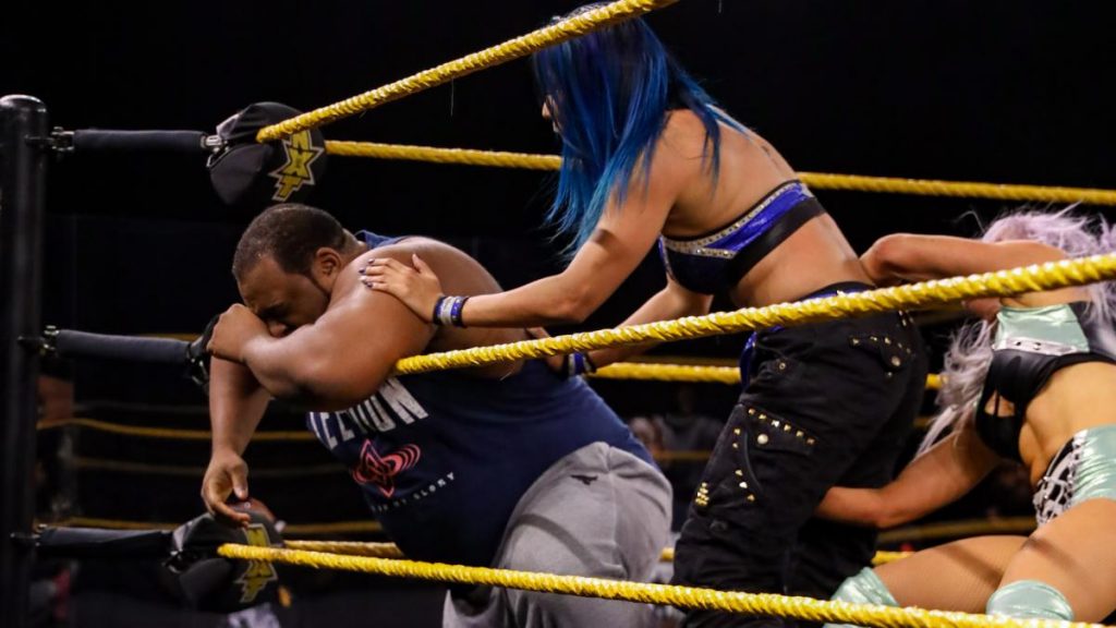 Candice LeRae sneaks up in Mia Yim while she's checking on Keith Lee