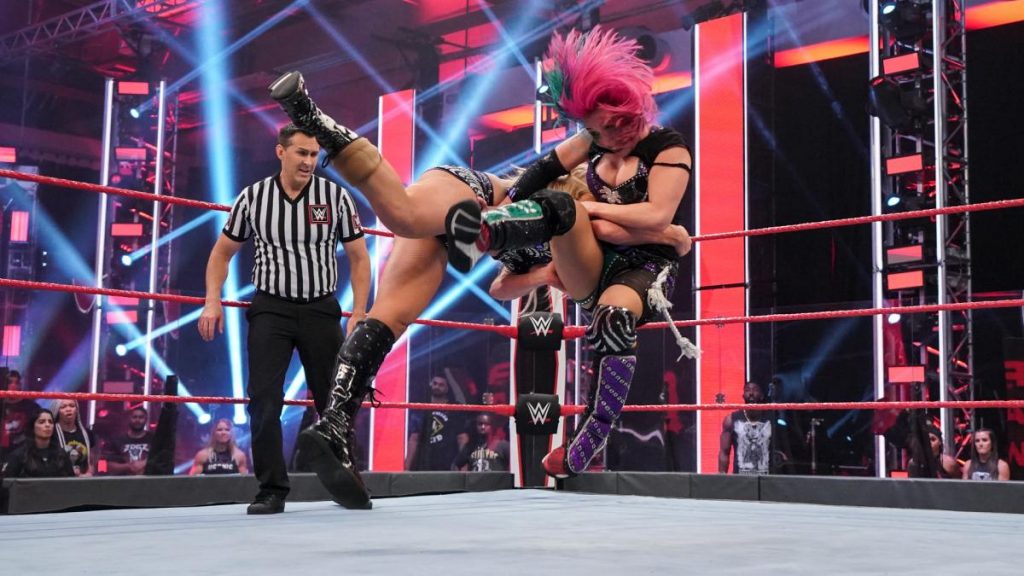 Charlotte Flair spears Asuka