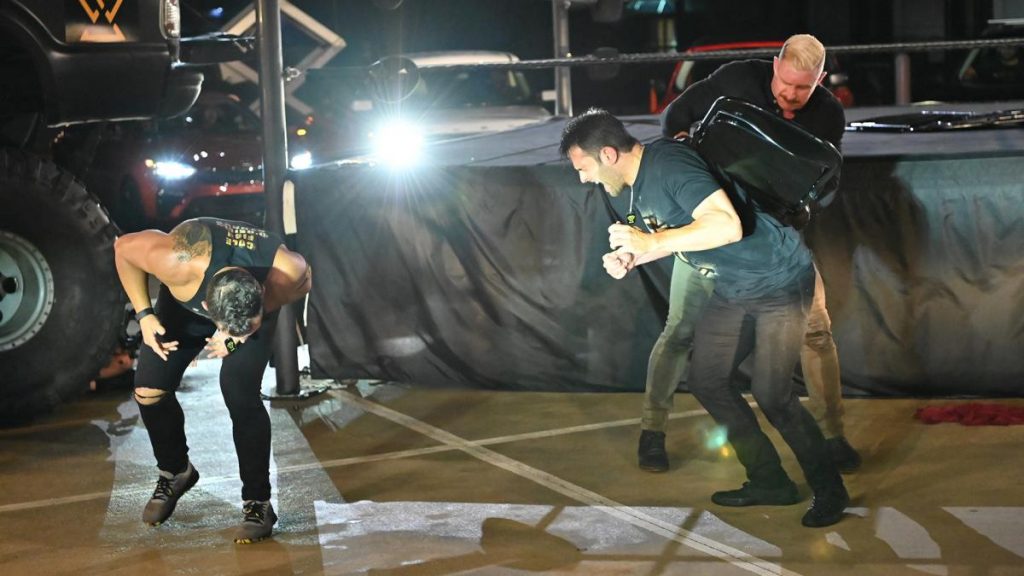 Dexter Lumis chases Roderick Strong and Bobby Fish away