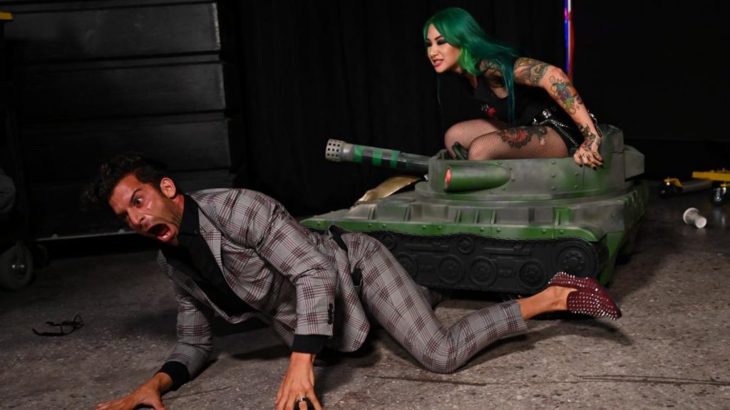 Shotzi Blackheart drives a tank over Robert Stone's leg