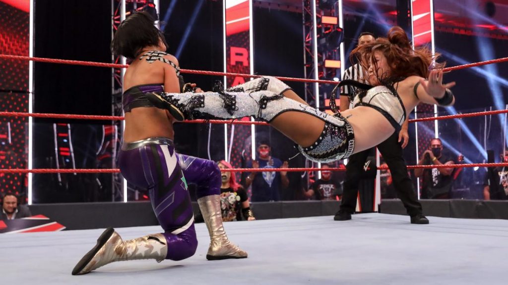 Kairi Sane dropkicks Bayley