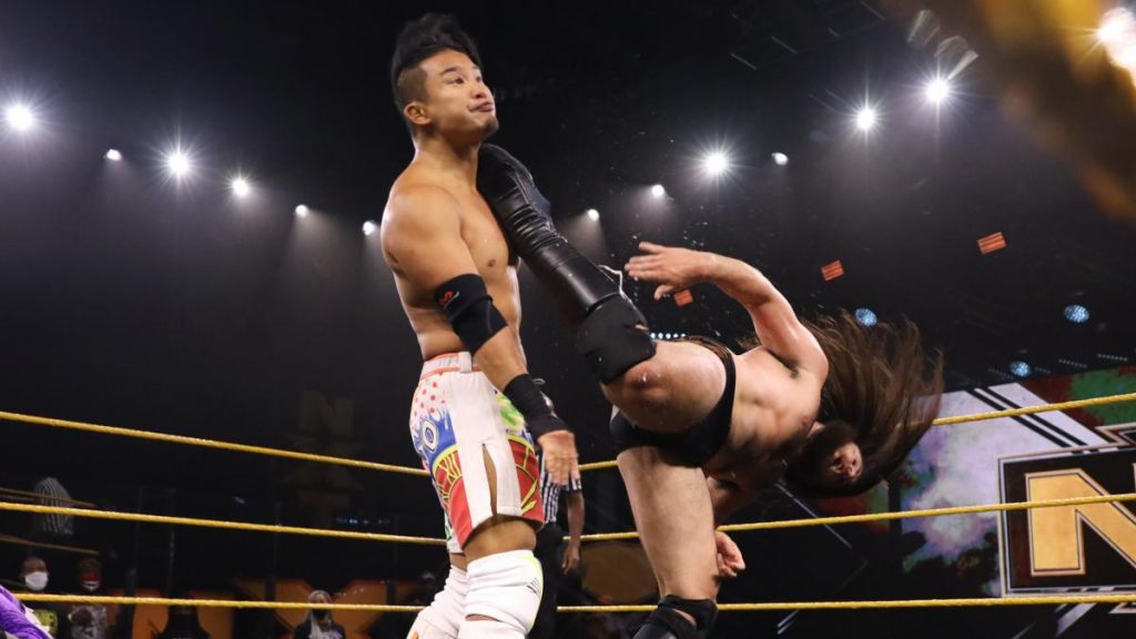 Cameron Grimes kicks Kushida in the head
