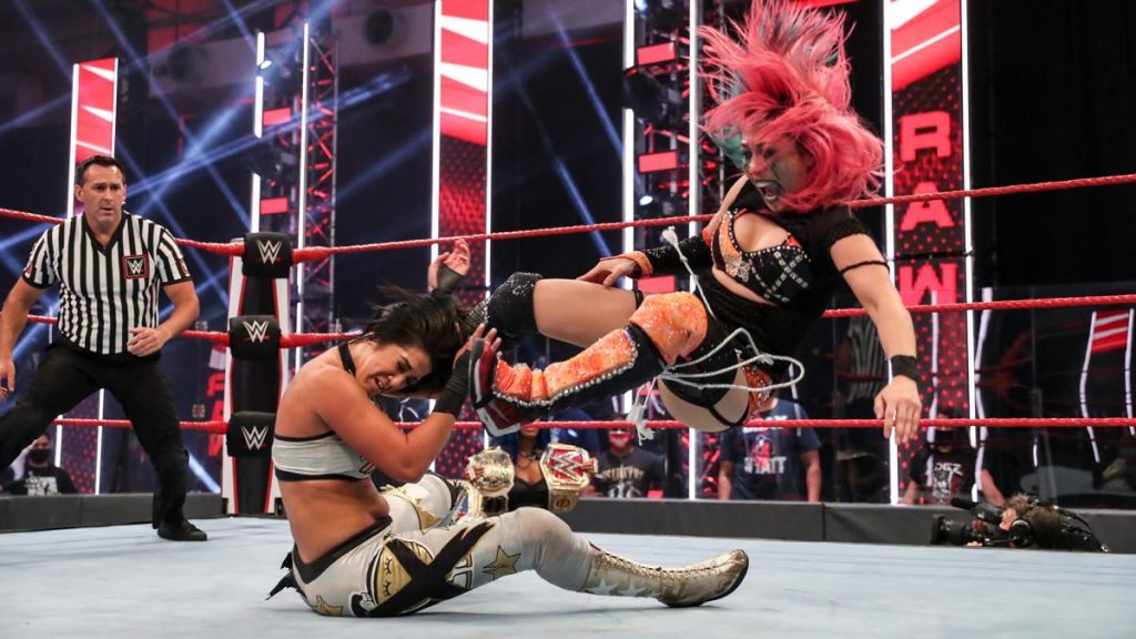 Asuka dropkicks Bayley