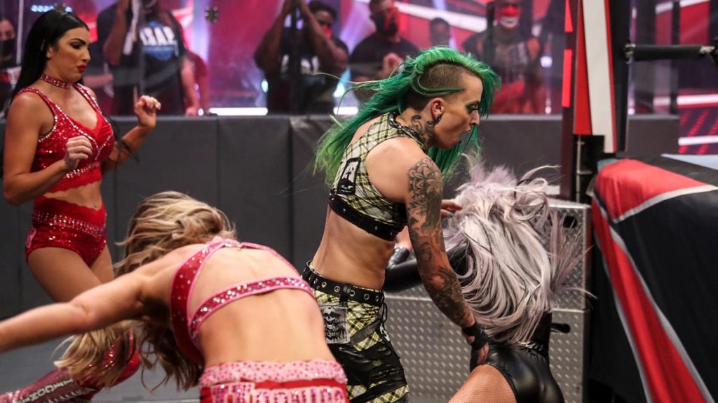 Peyton Royce shoves Ruby Riott into Liv Morgan