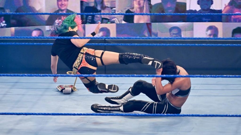 Asuka kicks Bayley in the head